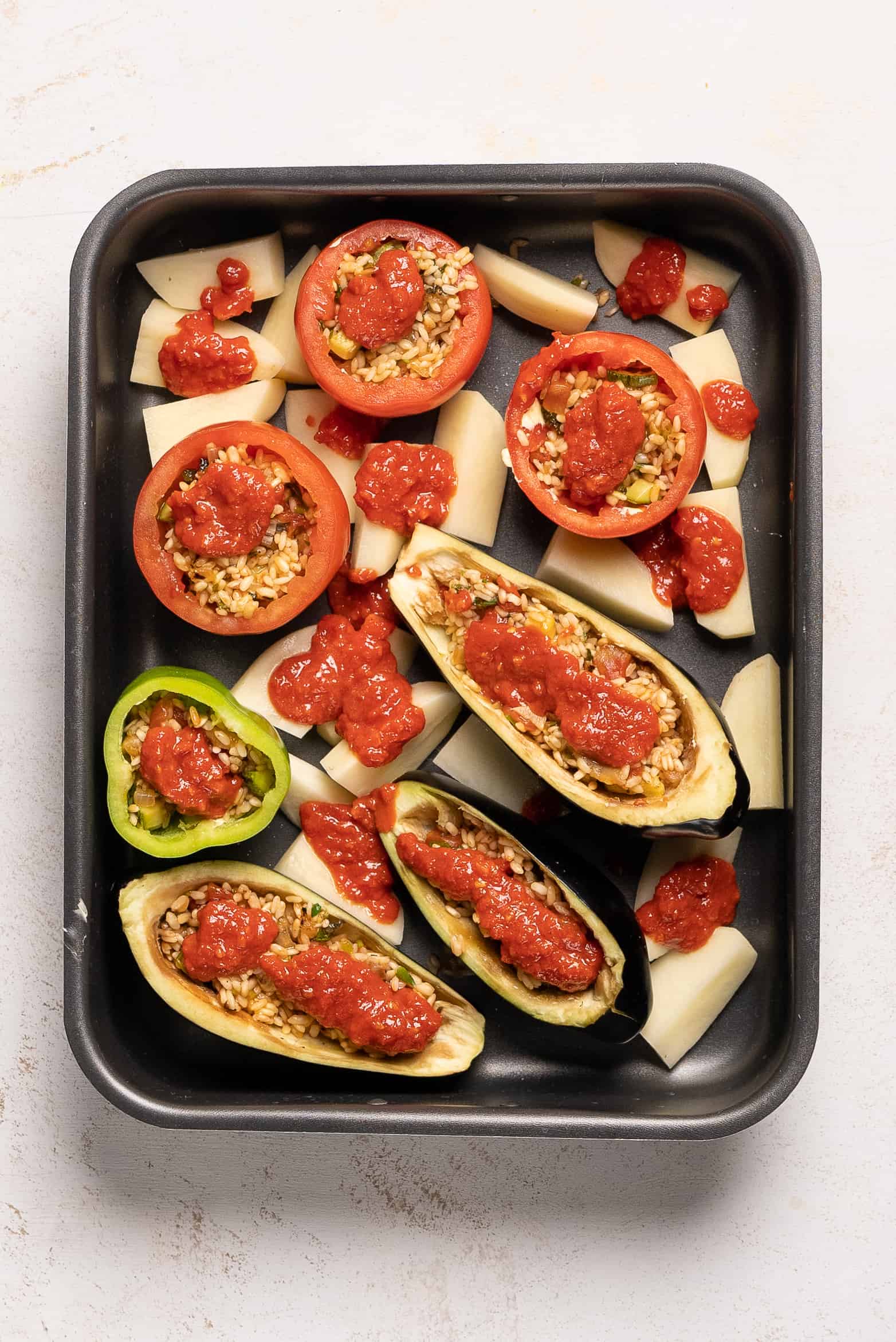 Gemista recipe (Greek Stuffed Tomatoes and Peppers with rice) - assembled